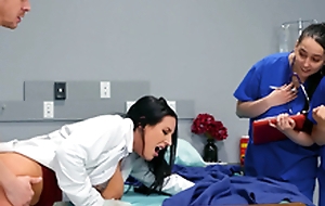 Doctor Angela White teaching her young med students on the job